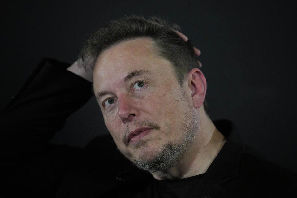 Tesla and SpaceX's CEO Elon Musk reacts during an in-conversation event with Britain's Prime Minister Rishi Sunak in London, Thursday, Nov. 2, 2023. Sunak discussed AI with Elon Musk in a conversation that is played on the social network X, which Musk owns.(AP Photo/Kirsty Wigglesworth, Pool)