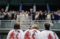 <p>The Clintons congratulate Jenny Thompson, Sheila Taormina, Christina Teuscher and Trina Jackson of the United States after winning gold medals on July 25, 1996. (Getty) </p>