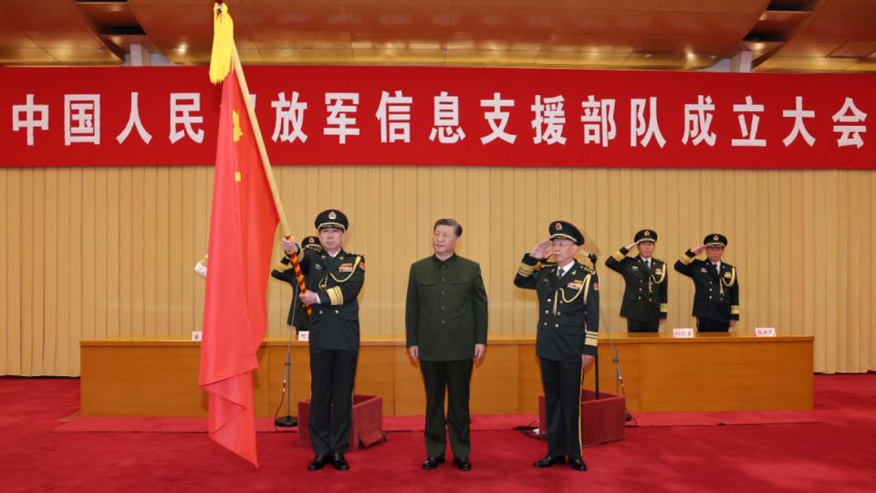 Chinese President Xi Jinping, center, attends a ceremony for the People's Liberation Army’s newly established Information Support Force on April 19, 2024. (Chinese Defense Ministry)