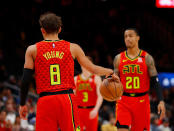 The Atlanta Hawks' Trae Young, who wore #8 instead of his usual #11 in his honour of Kobe Bryant, holds the ball for an eight second violation after tip-off in memory of Kobe Bryant during the game against the Washington Wizards at State Farm Arena on January 26, 2020 in Atlanta. (Photo by Kevin C. Cox/Getty Images)