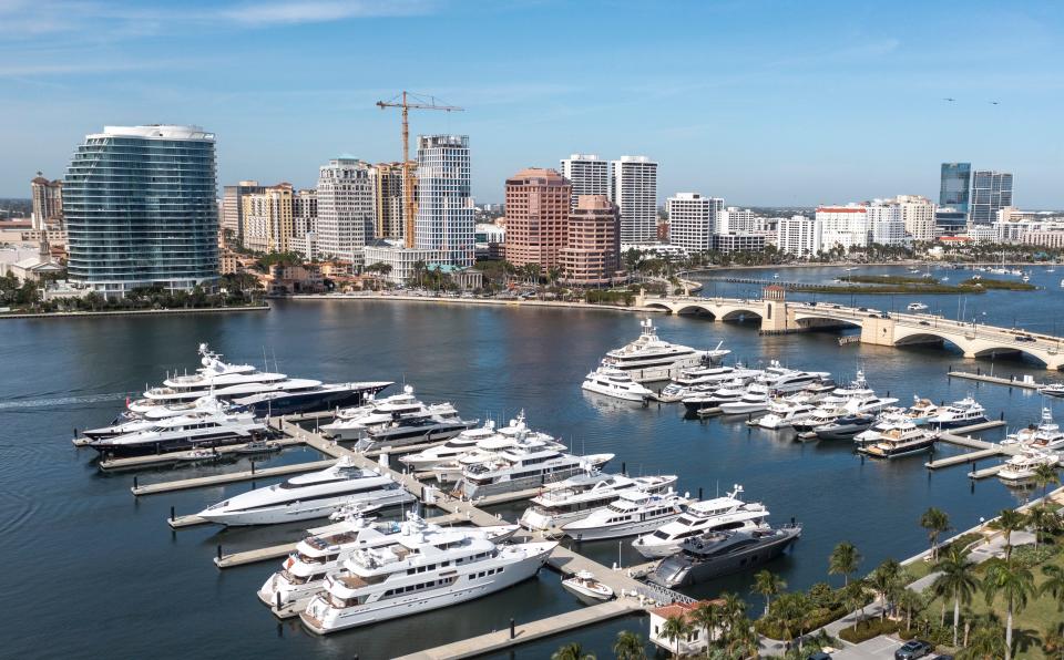 The city skyline, top, and the Palm Beach docks, bottom, on February 1, 2024 in West Palm Beach, Florida.