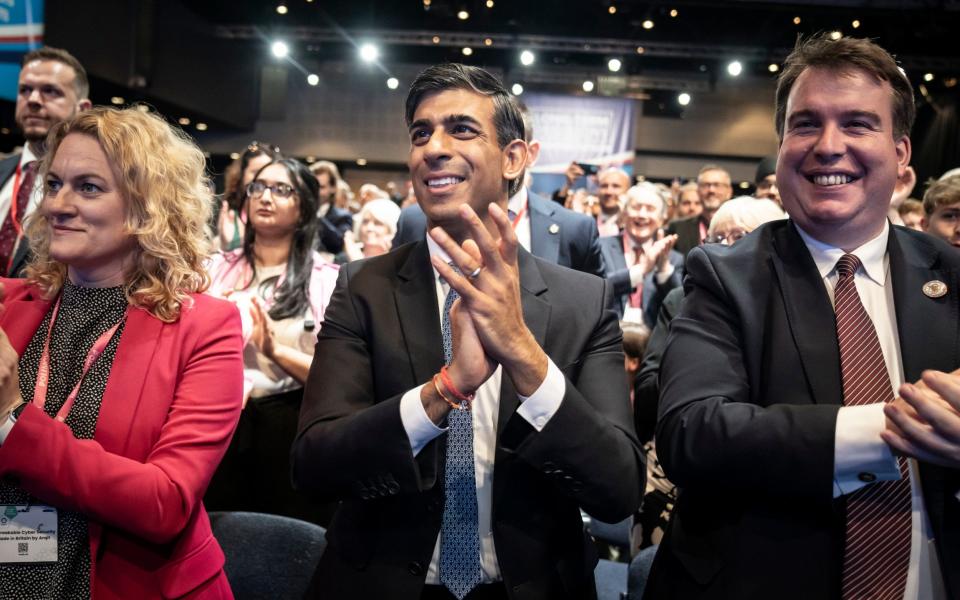 Rishi Sunak, the Prime Minister, applauds during Jeremy Hunt's speech on day two of Tory conference in Manchester