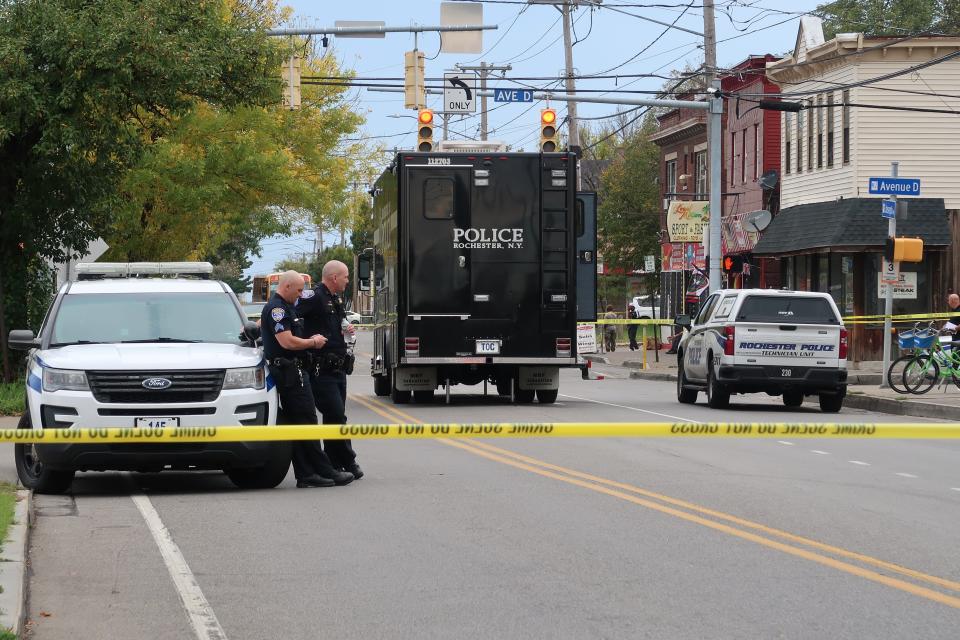 Rochester police closed down much of Avenue D between Joseph and North Clinton avenues Thursday afternoon after a short car chase ensued where a man suspected of murder fired two shots at two tactical officers. One officer returned fire, police said. No one was injured.