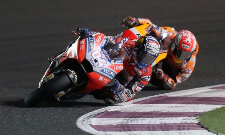 Winning style: Andrea Dovizioso held off Marc Marquez to win the Qatar MotoGP on Sunday