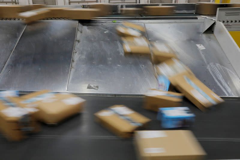 FILE PHOTO: Amazon packages are transported by conveyor belts inside of an Amazon fulfillment center on Cyber Monday in Robbinsville, New Jersey