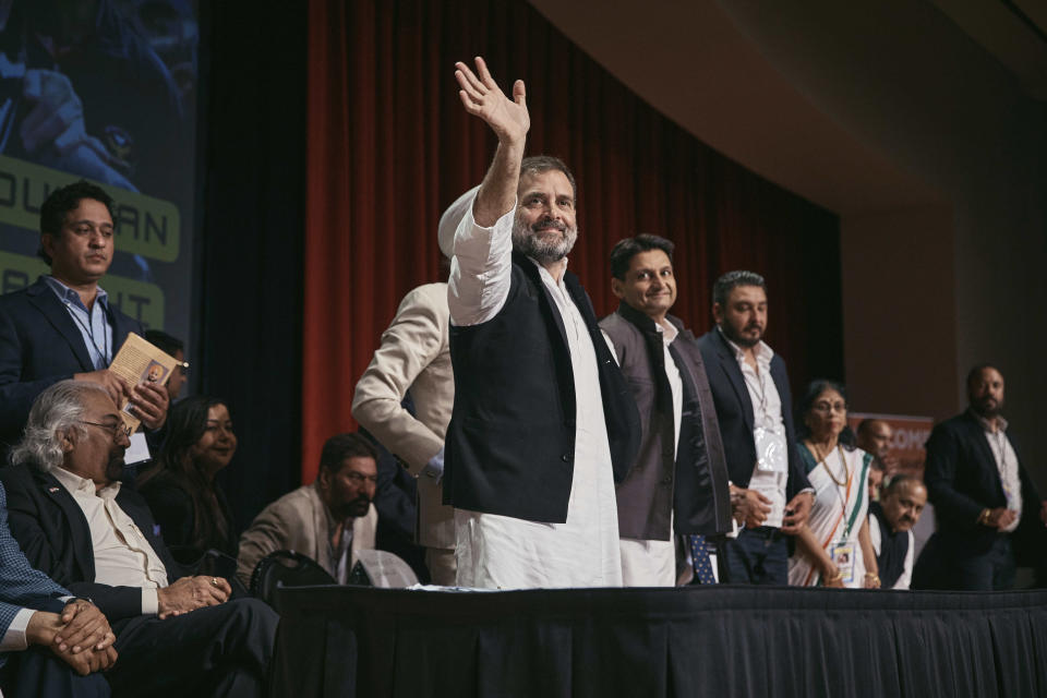 Indian politician Rahul Gandhi, center, waves after his speech at the Javits Center, Sunday, June 4, 2023, in New York. (AP Photo/Andres Kudacki)