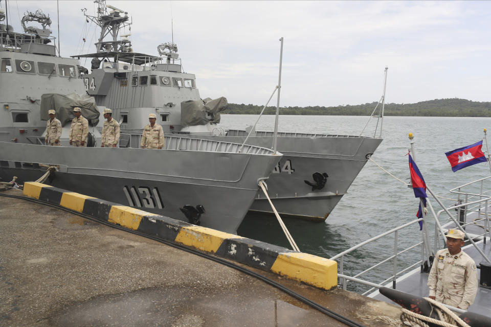 FILE - Cambodian navy crew stand on a patrol boat at the Ream Naval Base in Sihanoukville, southwest of Phnom Penh, Cambodia, July 26, 2019. Cambodian officials broke ground Wednesday, June 8, 2022, on a naval port expansion project in Ream, dismissing American concerns it could provide Beijing with a strategically important outpost on the Gulf of Thailand. (AP Photo/Heng Sinith, File)