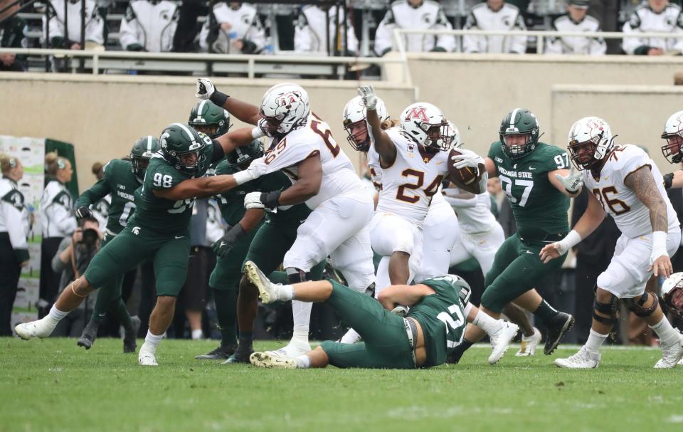 Michigan State Spartans defenders pursue Minnesota Golden Gophers running back Mohamed Ibrahim (24) during the first half at Spartan Stadium, Saturday, Sept. 24, 2022.