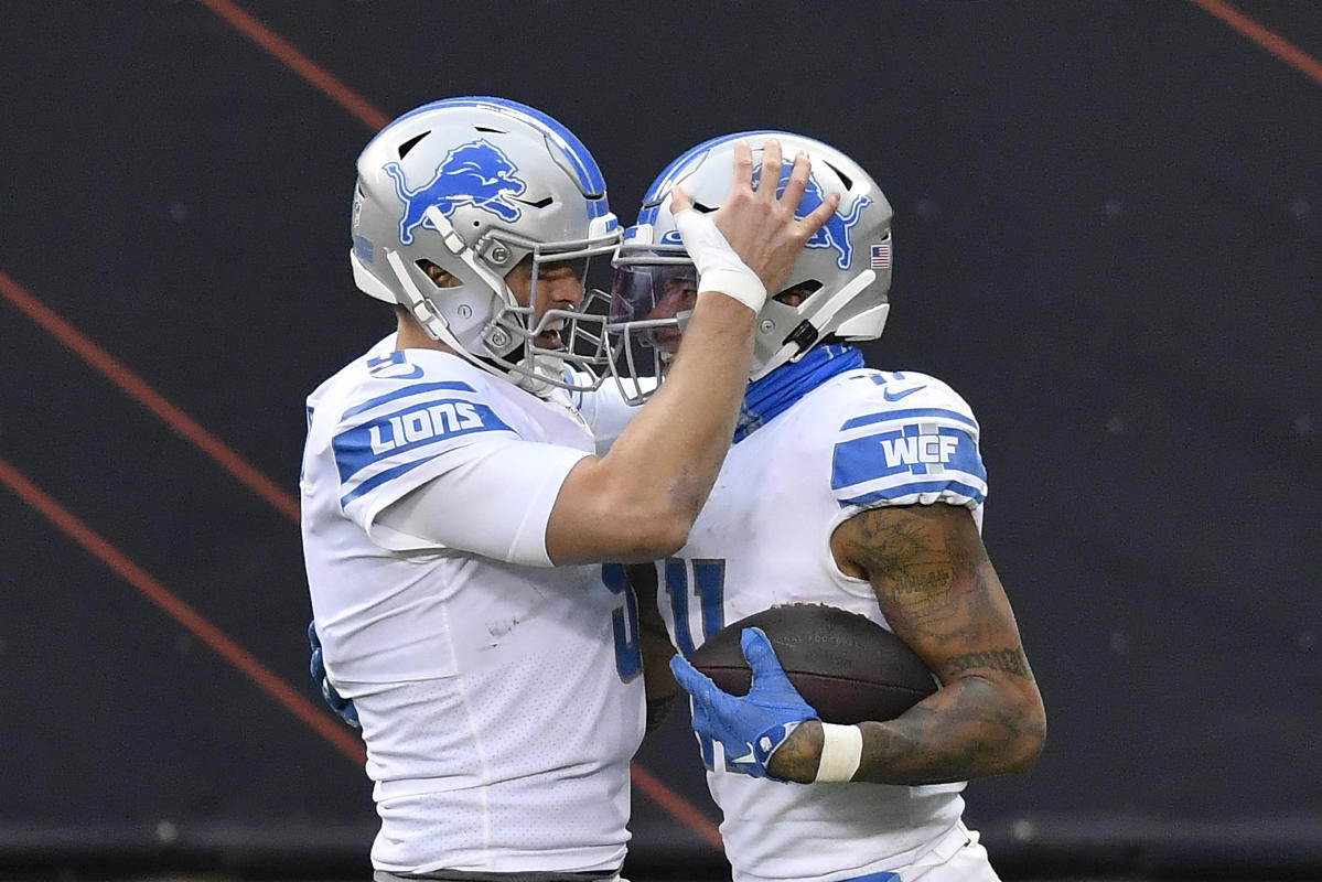 Adrian Peterson of the Detroit Lions celebrates his touchdown in the