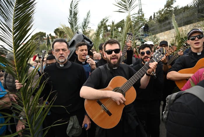 Christians walk in Palm Sunday procession in Jerusalem