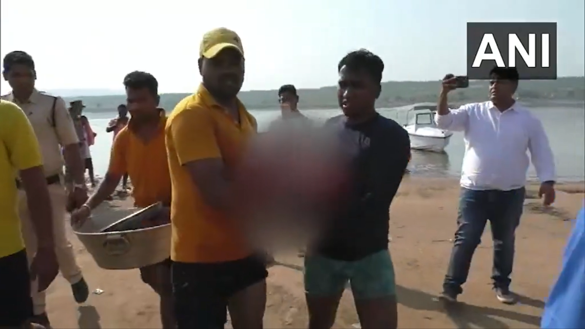 A video grab shows rescue workers retreiving bodies from the river after boat capsizes in Odisha, India  (Screengrab/ANI)