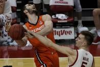 Wisconsin's Tyler Wahl blocks the shot of Illinois's Giorgi Bezhanishvili during the first half of an NCAA college basketball game Saturday, Feb. 27, 2021, in Madison, Wis. (AP Photo/Morry Gash)