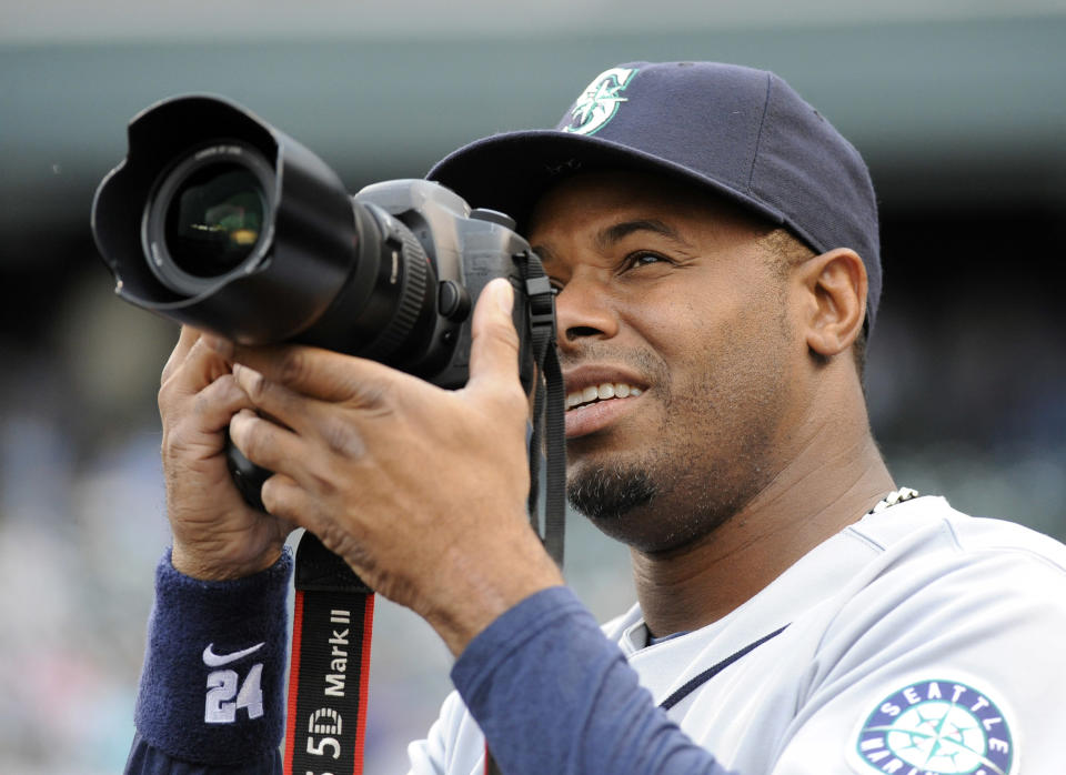 eattle Mariner's superstar, Ken Griffey, borrowed a photographer's camera and took a few pictures from the dugout just before they played the Colorado Rockies at Coors Field Friday evening.