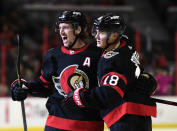 Ottawa Senators left wing Tim Stutzle (18) celebrates his goal against the Colorado Avalanche with defenseman Thomas Chabot (72) during the second period of an NHL hockey game Saturday, Dec. 4, 2021, in Ottawa, Ontario. (Justin Tang/The Canadian Press via AP)