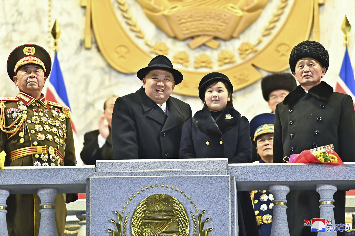 North Korean leader Kim Jong Un, center left, with his daughter, reportedly named Kim Ju Ae and aged about 10, center right, attend a military parade to mark the 75th founding anniversary of the Korean People's Army on Kim Il Sung Square in Pyongyang, North Korea Wednesday, Feb. 8, 2023. (Korean Central News Agency/Korea News Service via AP)