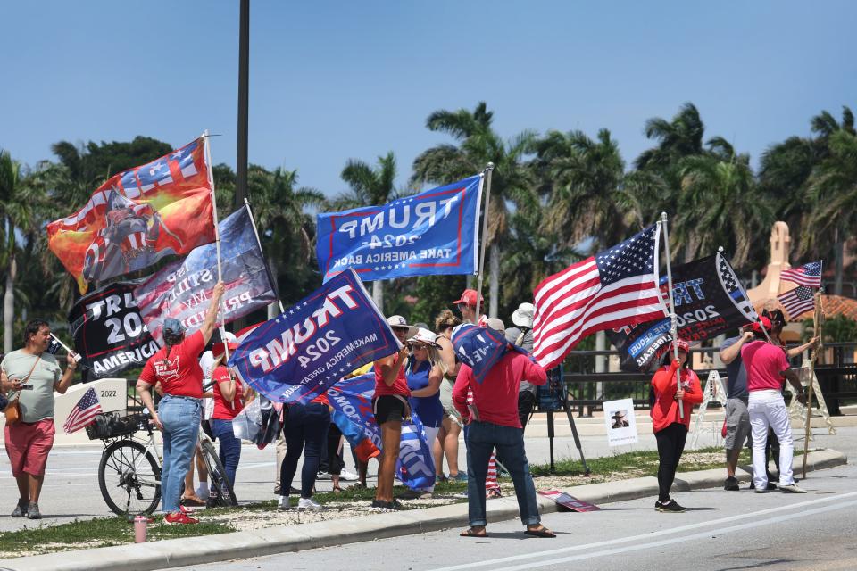 PALM BEACH, FLORIDA - JUNE 11: Supporters of former President Donald Trump gather near his Mar-A-Lago home after he was indicted on a new set of charges related to the mishandling of classified documents on June 11, 2023 in Palm Beach, Florida. Trump is expected to be arraigned in Miami on Tuesday. (Photo by Scott Olson/Getty Images) ORG XMIT: 775989086 ORIG FILE ID: 1497710886