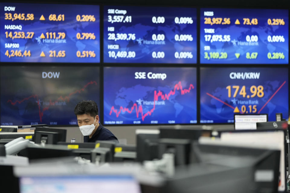 A currency trader watches monitors at the foreign exchange dealing room of the KEB Hana Bank headquarters in Seoul, South Korea, Wednesday, June 23, 2021. Asian stock markets followed Wall Street higher on Wednesday after the Federal Reserve chairman said higher U.S. inflation probably is temporary, helping to calm fears central bankers might feel pressure to roll back economic stimulus. (AP Photo/Ahn Young-joon)