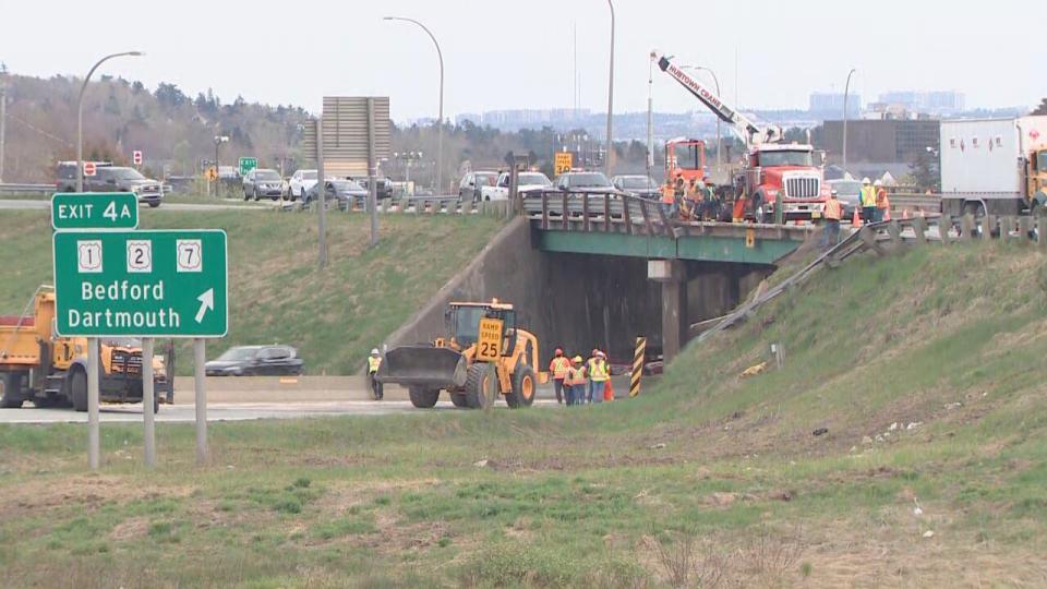A portion of Highway 102 was closed after the tractor-trailer fell off the overpass. 