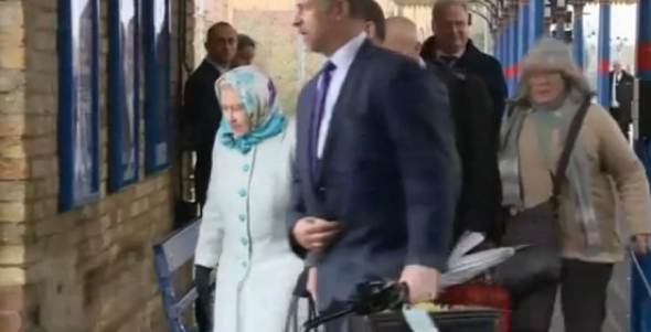 Oblivious train passenger nearly bumps into the Queen