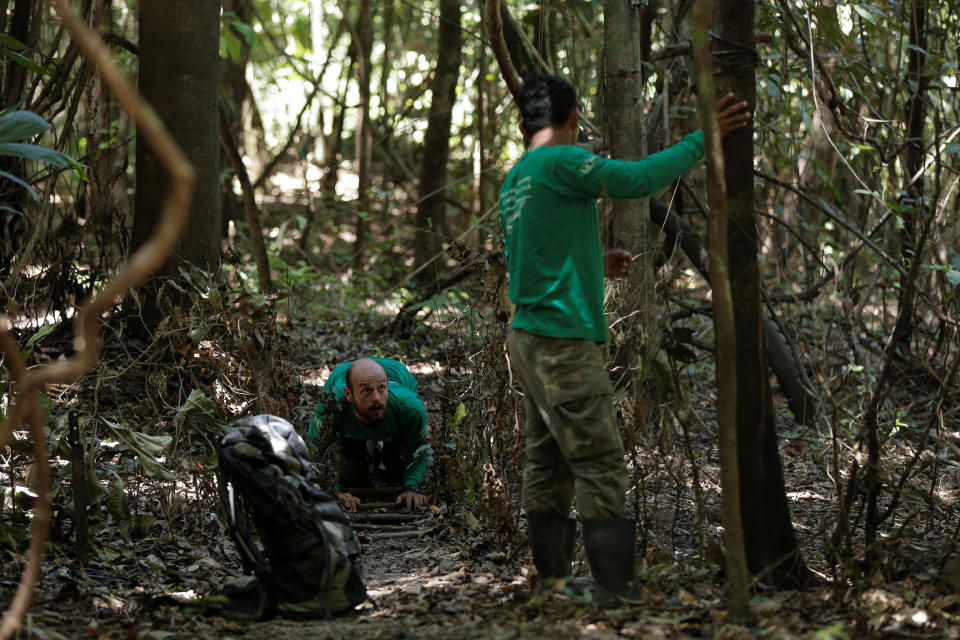 <p>Researcher Diogo Maia Grabin (L) and his assistant Railgler dos Santos from the Mamiraua Institute install camera traps at the Mamiraua Sustainable Development Reserve in Uarini, Amazonas state, Brazil, Feb. 9, 2018. (Photo: Bruno Kelly/Reuters) </p>