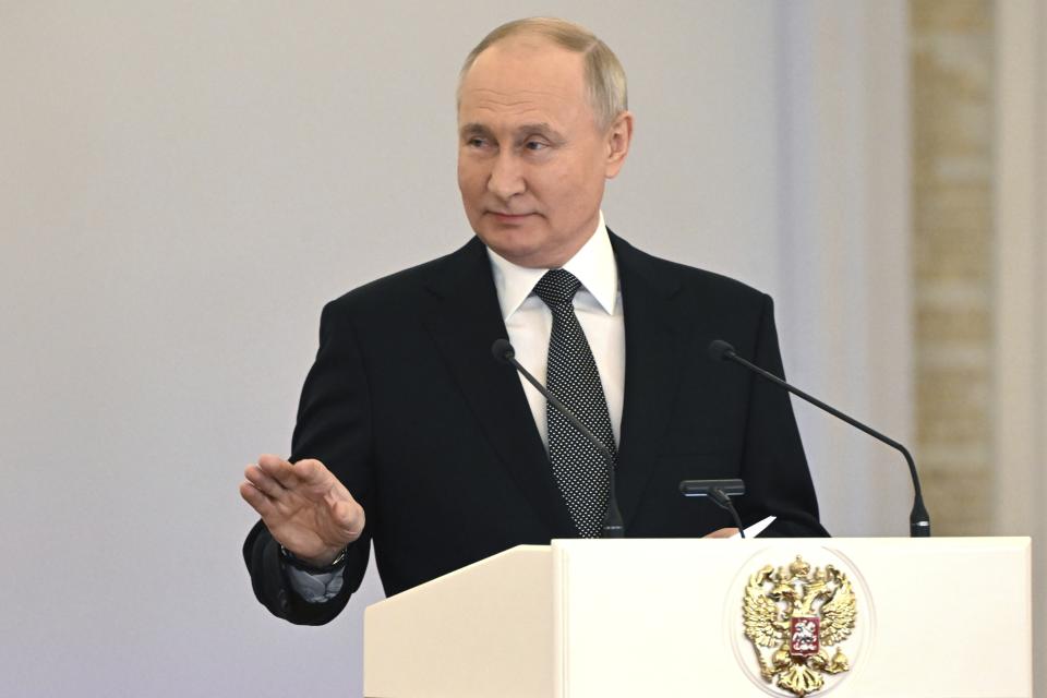 Russian President Vladimir Putin gestures as he delivers a speech during a ceremony to present Gold Star medals to Heroes of Russia on the eve of Heroes of the Fatherland Day at the St. George Hall of the Grand Kremlin Palace in Moscow, Russia, Friday, Dec. 8, 2023. (Sergei Guneyev, Sputnik, Kremlin Pool Photo via AP)