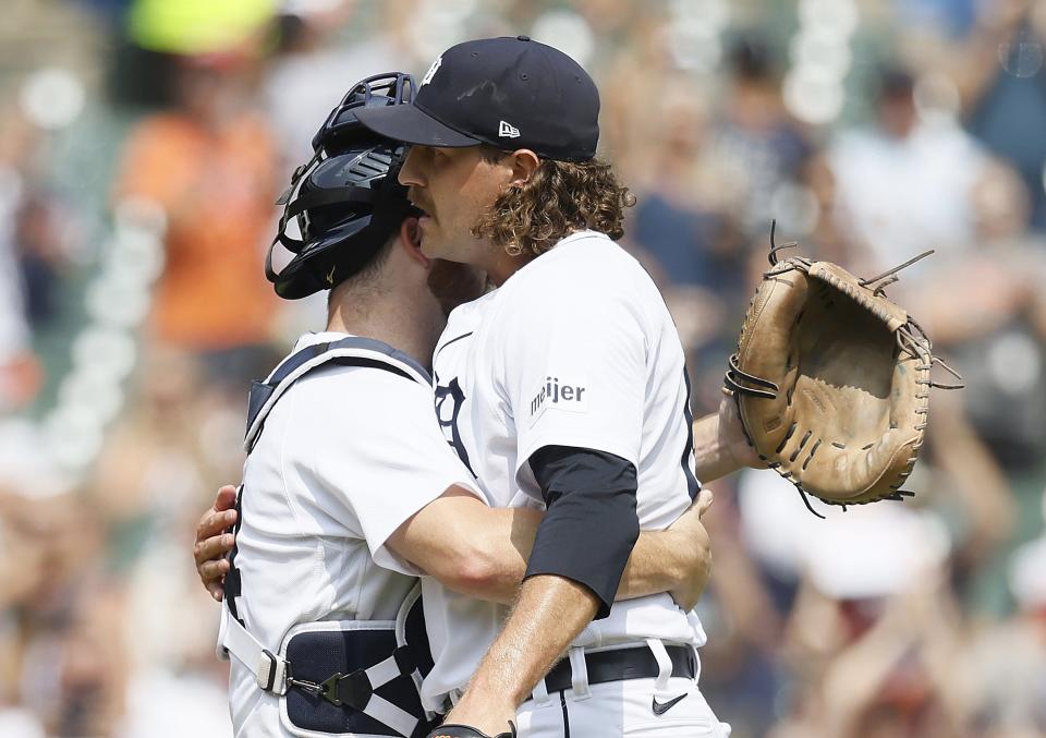 Catcher Jake Rogers of the Detroit Tigers hugs Jason Foley #68 after a 5-1 win over the San Francisco Giants at Comerica Park on July 24, 2023 in Detroit, Michigan.