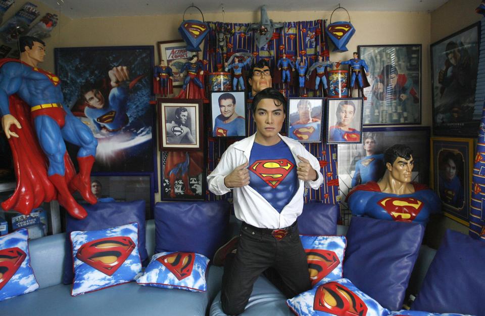 Herbert Chavez poses with his Superman memorabilia inside his house in Calamba Laguna, south of Manila