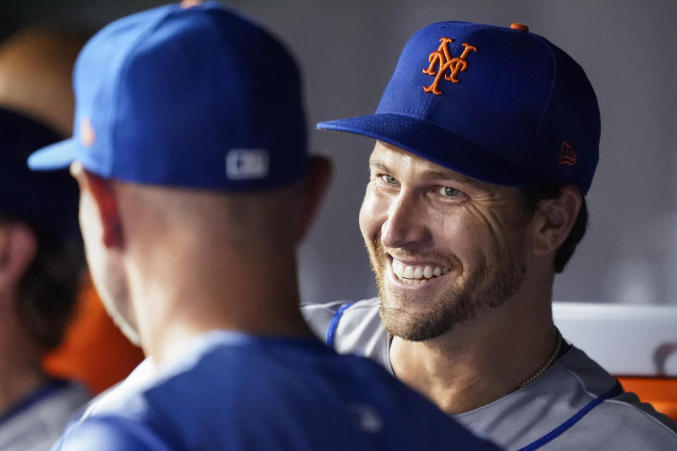 New York Mets starting pitcher Jacob deGrom smiles during the sixth inning of a baseball game against the Washington Nationals at Nationals Park, Tuesday, Aug. 2, 2022, in Washington. (AP Photo/Alex Brandon)