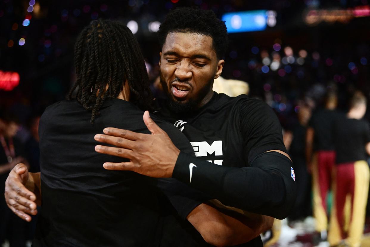 Cavaliers guard Donovan Mitchell hugs guard Darius Garland during introductions before Game 7 of a first-round playoff series, May 5, 2024, in Cleveland.