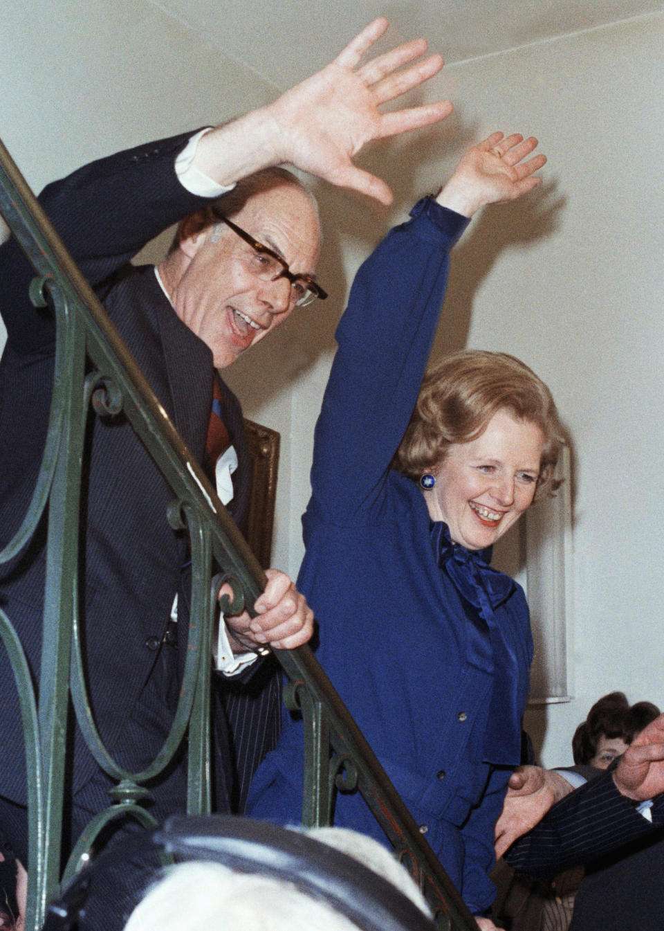 FILE - Britain's Conservative Party Leader Margaret Thatcher with her husband Dennis gives a jubilant wave at her party headquarters on election night in London, May 4, 1979. Britain’s upcoming general election on July 4, 2024, is widely expected to lead to a change of government for the first time in 14 years. Britain's general election in 1979 is without doubt the most consequential since 1945, with Margaret Thatcher becoming the country’s first female prime minister on a radical Conservative economic agenda. At its heart, Thatcherism represented a total rethink over the role of the state. (AP Photo/Bob Dear, File)