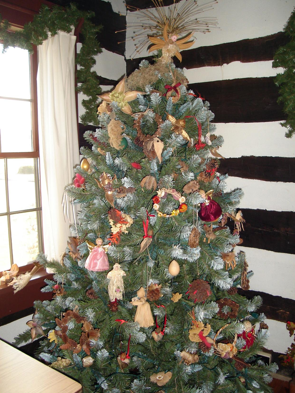 A decorated Christmas tree at the log house at Dover Community Park decorated by the Conewago Garden Club using natural ornaments in 2008.