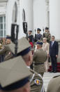 Lithuanian Prime Minister Ingrida Simonyte, second right, being greeted by Poland's Prime Minister Mateusz Morawiecki on a visit for talks that include the region's security in the face of migrant pressure on the two countries' borders with Belarus, in Warsaw, Poland, on Friday, Sept. 17, 2021. (AP Photo/Czarek Sokolowski)