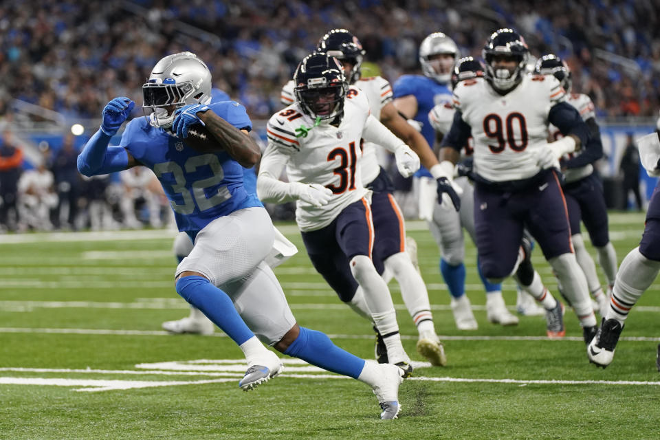 Detroit Lions running back D'Andre Swift rushes for a 17-yard touchdown during the first half of an NFL football game against the Chicago Bears, Sunday, Jan. 1, 2023, in Detroit. (AP Photo/Paul Sancya)