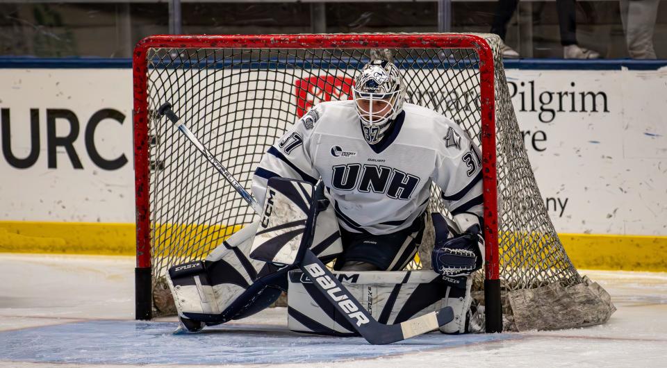 University of New Hampshire goalie Jakob Hellsten makes a save against Princeton University in a game last month at the Whittemore Center. Hellsten, who transferred to UNH from North Dakota, has a 9-6-1 record with a 1.94 goals-against average this season, his first with the Wildcats.