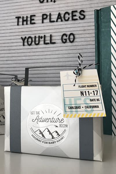 a suitcase favor is a great baby shower idea for a party with an adventure theme