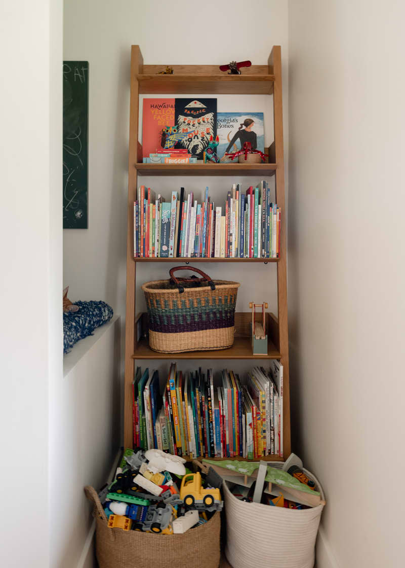 Bookshelf filled with kids books.