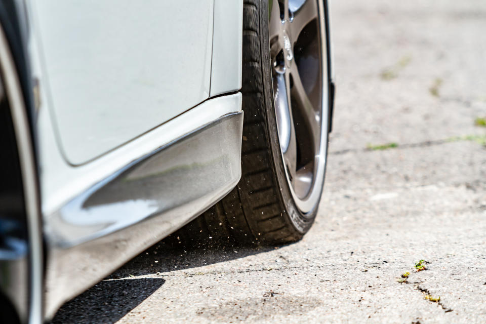 A car backing up on pavement