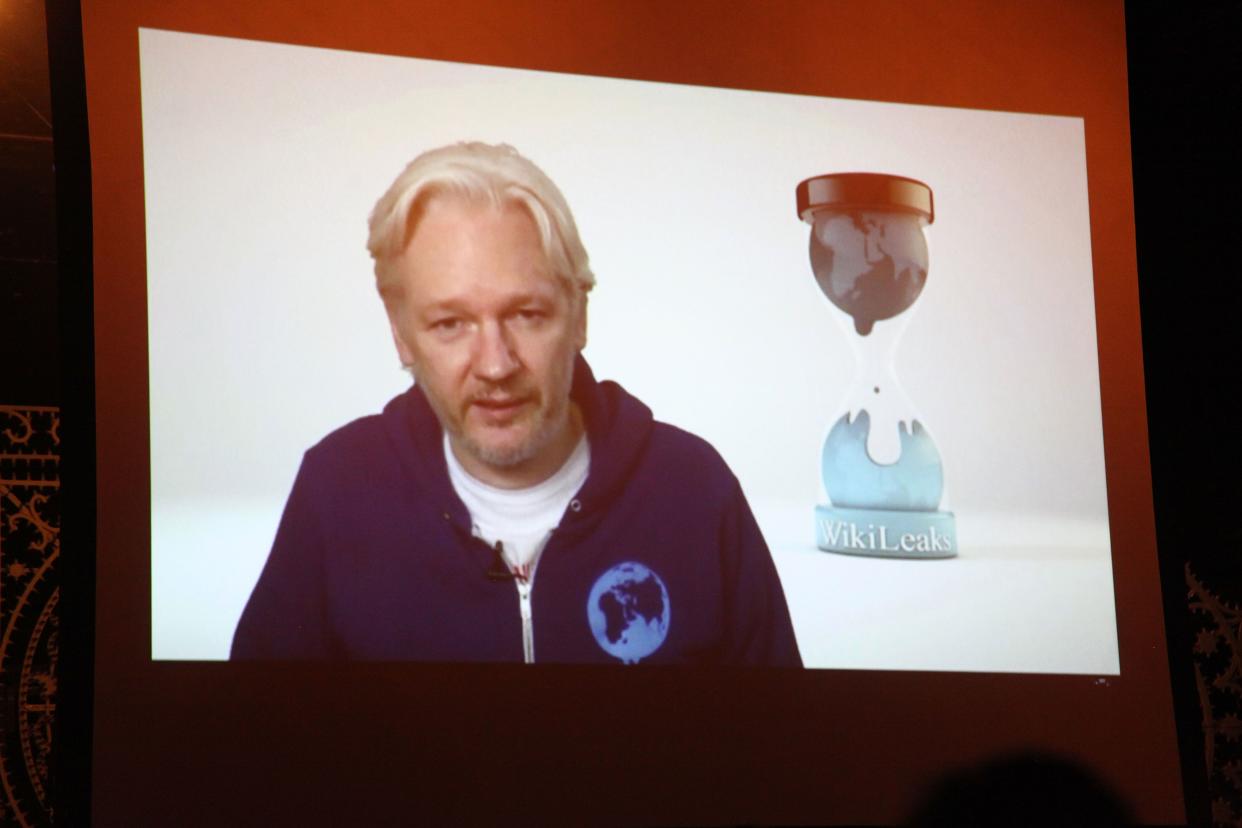 Wikileaks founder Julian Assange introduces M.I.A. via videolink from the Ecuadorian embassy in London at Terminal 5 on November 1, 2013 in New York.