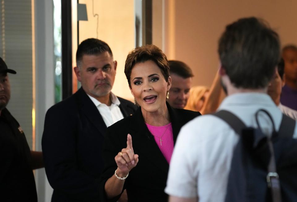 Republican gubernatorial candidate Kari Lake labels the press "fake news" as she refuses to answer questions from the media after filming on the set of AZTV7 on Saturday, Oct. 22,. 2022. 