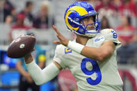 Los Angeles Rams quarterback Matthew Stafford (9) warms up before an NFL football game against the Arizona Cardinals, Sunday, Sept. 25, 2022, in Glendale, Ariz. (AP Photo/Rick Scuteri)