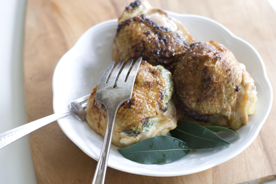 This Nov. 11, 2013 photo shows spinach stuffed chicken thighs in Concord, N.H. (AP Photo/Matthew Mead)