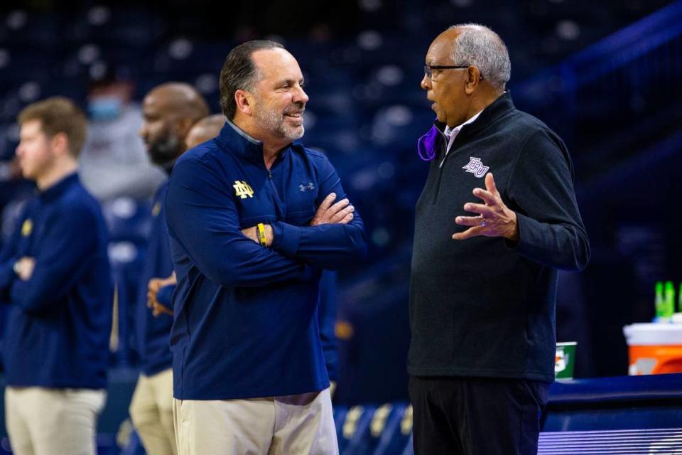 Notre Dame Coach Mike Brey, left, chatted with current High Point and former-Kentucky coach Tubby Smith before the Fighting Irish beat the Panthers 70-61 on Nov. 16 in South Bend, Ind.