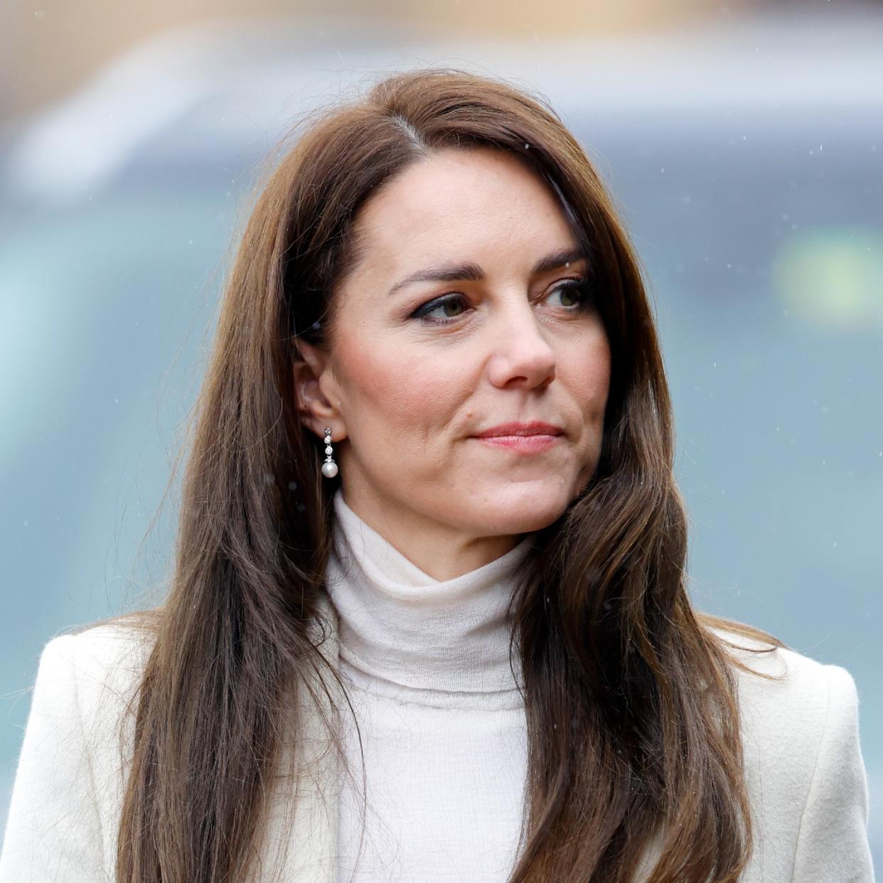  Kate Middleton tersely smiles at an engagement 