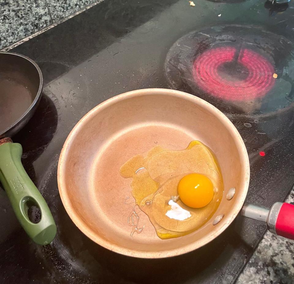 Egg in pan for Gordon Ramsay fried eggs