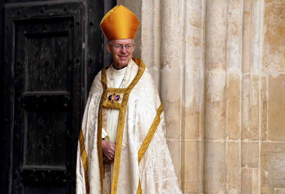 archbishop of canterbury justin welby smiles at westminster abbey in central london on may 6, 2023, ahead of the coronations of britains king charles iii and britains camilla, queen consort the set piece coronation is the first in britain in 70 years, and only the second in history to be televised charles will be the 40th reigning monarch to be crowned at the central london church since king william i in 1066 outside the uk, he is also king of 14 other commonwealth countries, including australia, canada and new zealand camilla, his second wife, will be crowned queen alongside him, and be known as queen camilla after the ceremony photo by andrew milligan pool afp photo by andrew milliganpoolafp via getty images