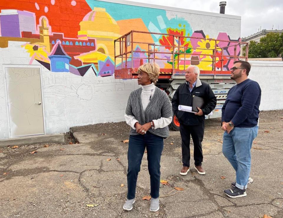 From left, Betty Smith, Ted Swaldo and Mike Scott stand outside the former Ziegler Tire building in downtown Canton. The building will become the permanent home of EN-RICH-MENT Fine Arts Academy. A fundraising campaign is being launched for the project.