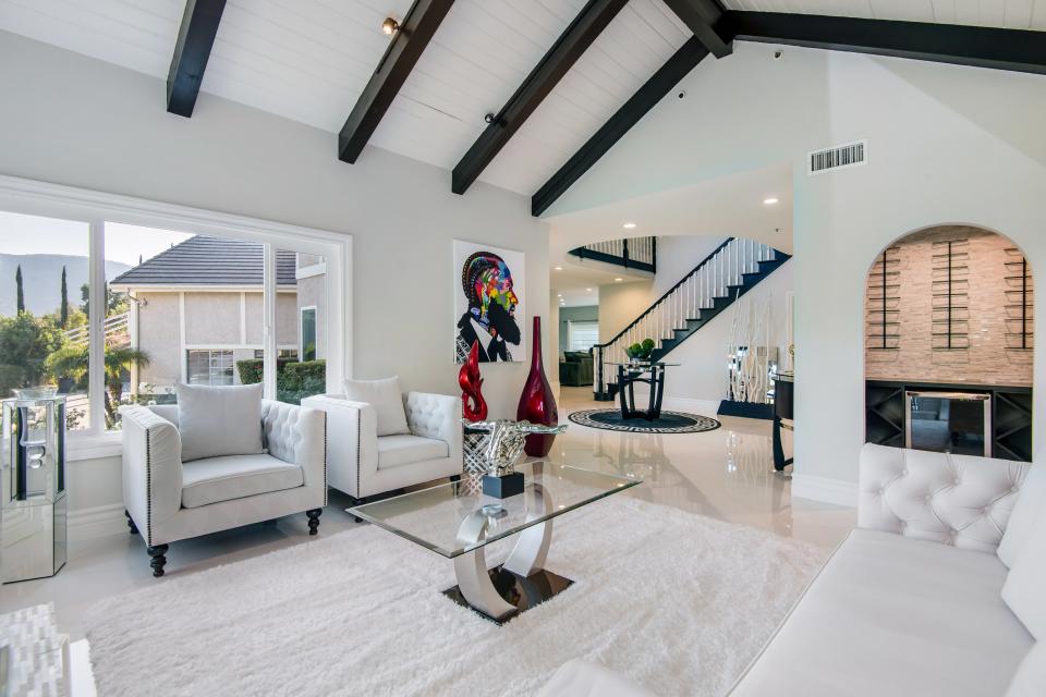 Exposed beams provide contrast in the living room.