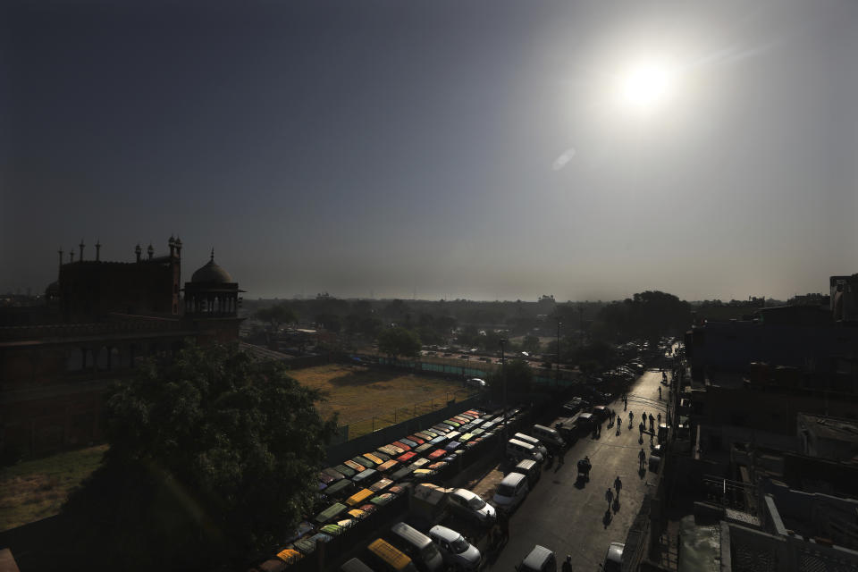 The Jama Mosque is silhouetted against the morning sun during Eid al-Fitr at the old quarters of New Delhi, India, Monday, May 25, 2020. The holiday of Eid al-Fitr, the end of the fasting month of Ramadan, a usually joyous three-day celebration has been significantly toned down as coronavirus cases soar. (AP Photo/Manish Swarup)