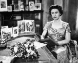 <p>As the technology changed, so did the Queen's Christmas addresses, and in 1957, <a href="https://www.townandcountrymag.com/society/tradition/a12474983/queens-first-christmas-message-broadcast-televised/" rel="nofollow noopener" target="_blank" data-ylk="slk:her message was televised for the first time;elm:context_link;itc:0;sec:content-canvas" class="link ">her message was televised for the first time</a>. The desk is decorated with portraits of Prince Charles and Princess Anne.</p>