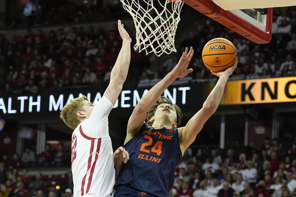 Illinois's Matthew Mayer (24) shoots against Wisconsin's Steven Crowl during the first half of an NCAA college basketball game, Saturday, Jan. 28, 2023, in Madison, Wis. (AP Photo/Andy Manis)